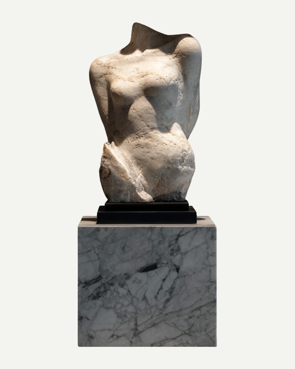 A fragmented marble torso on a stone block, from the deck's Pillars of Creation page